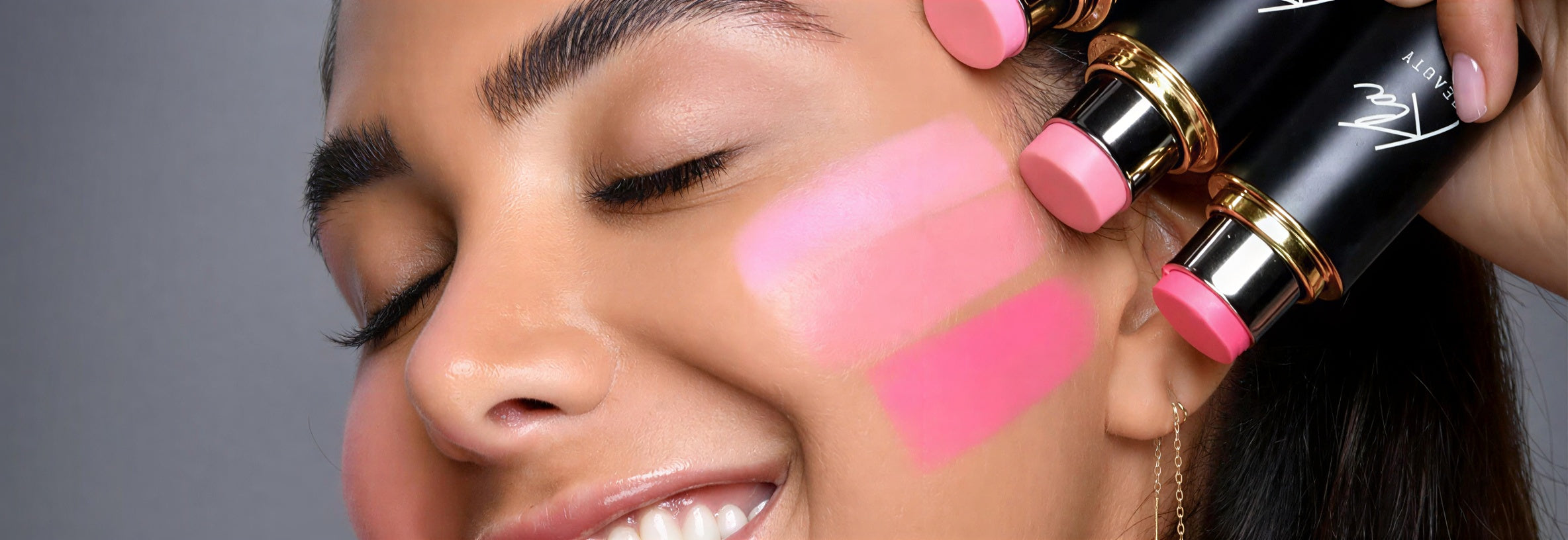 Luxury blush sticks collection in various pink shades for a radiant glow.