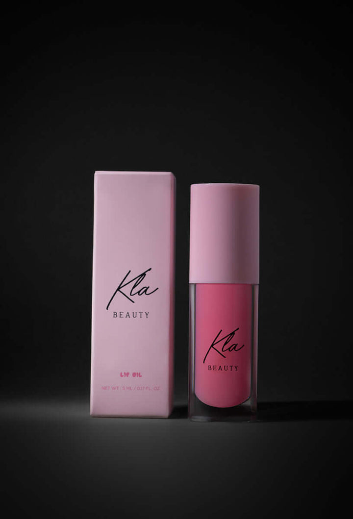 KLA Beauty Lip Oil in Raspberry, vegan formula with hydrating hyaluronic acid for soft, glossy, plump lips.