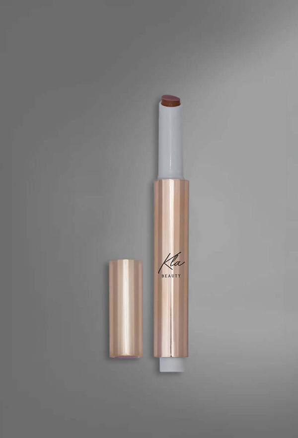 KLA Beauty Lip Balm Stick in Nude shade, paraben-free formula for hydrated, plump lips.