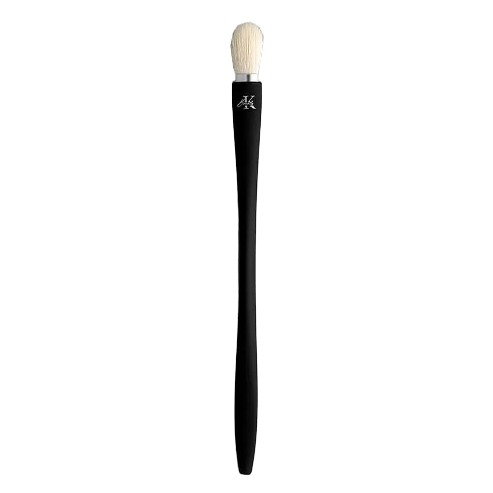KLA-beauty blending brush with black handle and white bristles on gray background