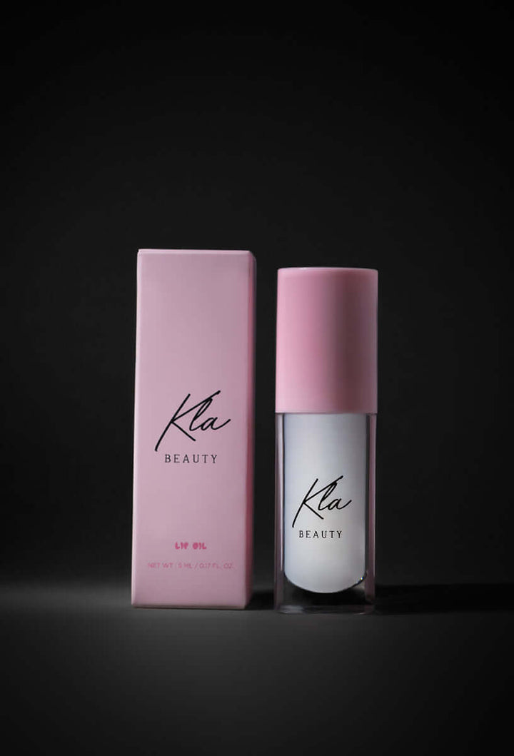 KLA Beauty Lip Oil bottle and packaging, featuring vegan, milky color gloss with hydrating hyaluronic acid and fruit extracts.