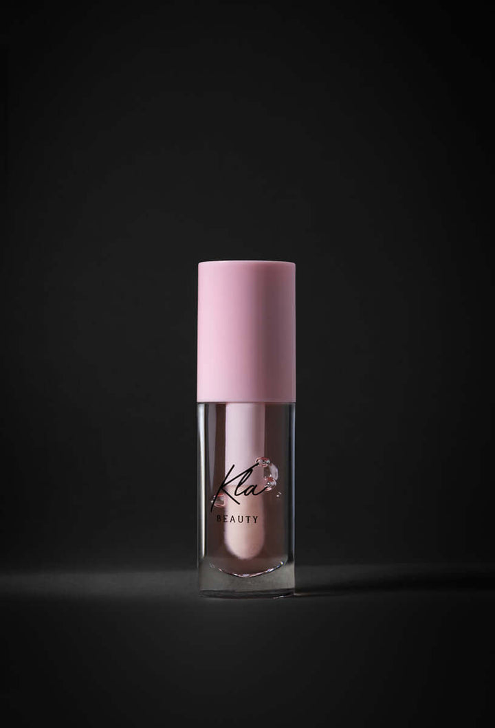 KLA Beauty Lip Oil in Transparent Pink with hydrating hyaluronic acid for glossy, vegan, cruelty-free lip care.