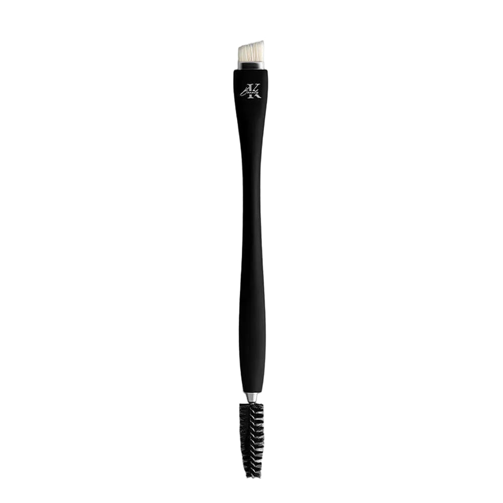 KLA-beauty double ended eyebrow brush with bristle and spoolie ends on a grey background