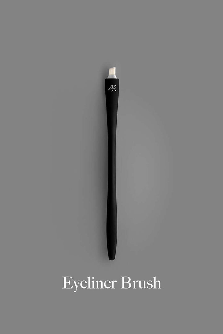 KLA-beauty sleek black eyeliner brush on gray background